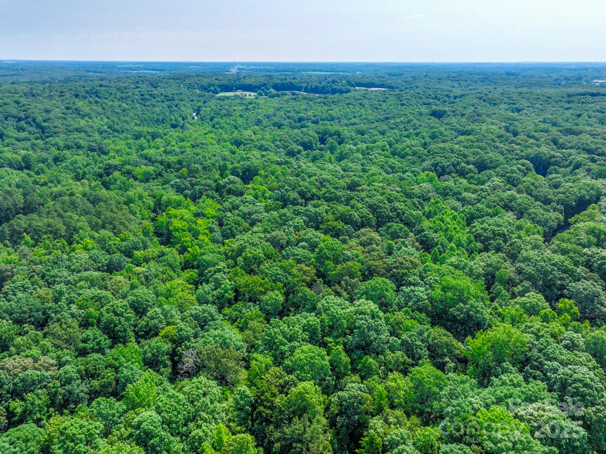 Lot 33 Valley Farm Road, Unit 33 Waxhaw, NC 28173 - Photo 19 of 35 an aerial view of residential houses with outdoor space and trees