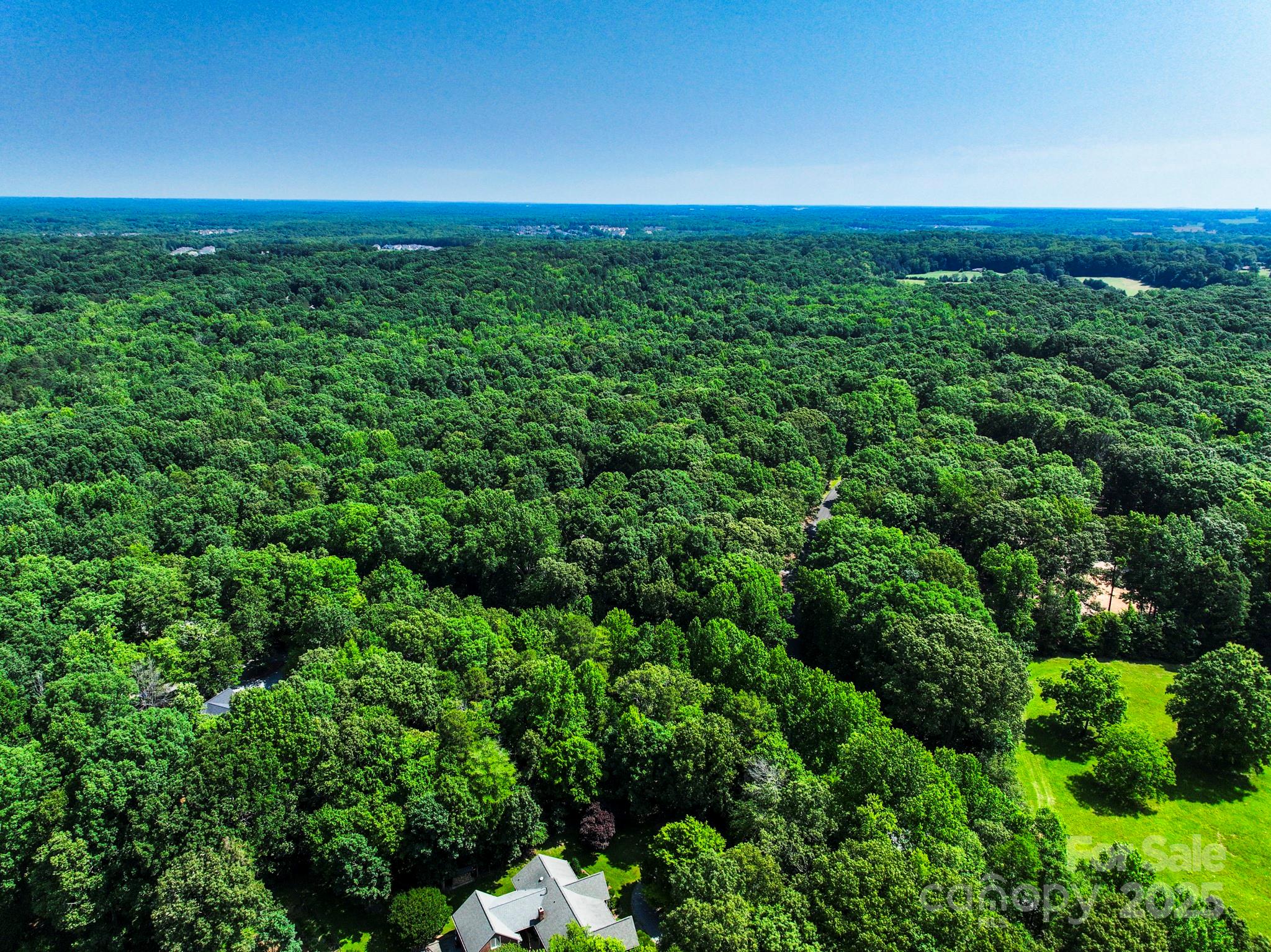 Lot 33 Valley Farm Road, Unit 33 Waxhaw, NC 28173 - Photo 22 of 35 a view of a green field with lots of bushes
