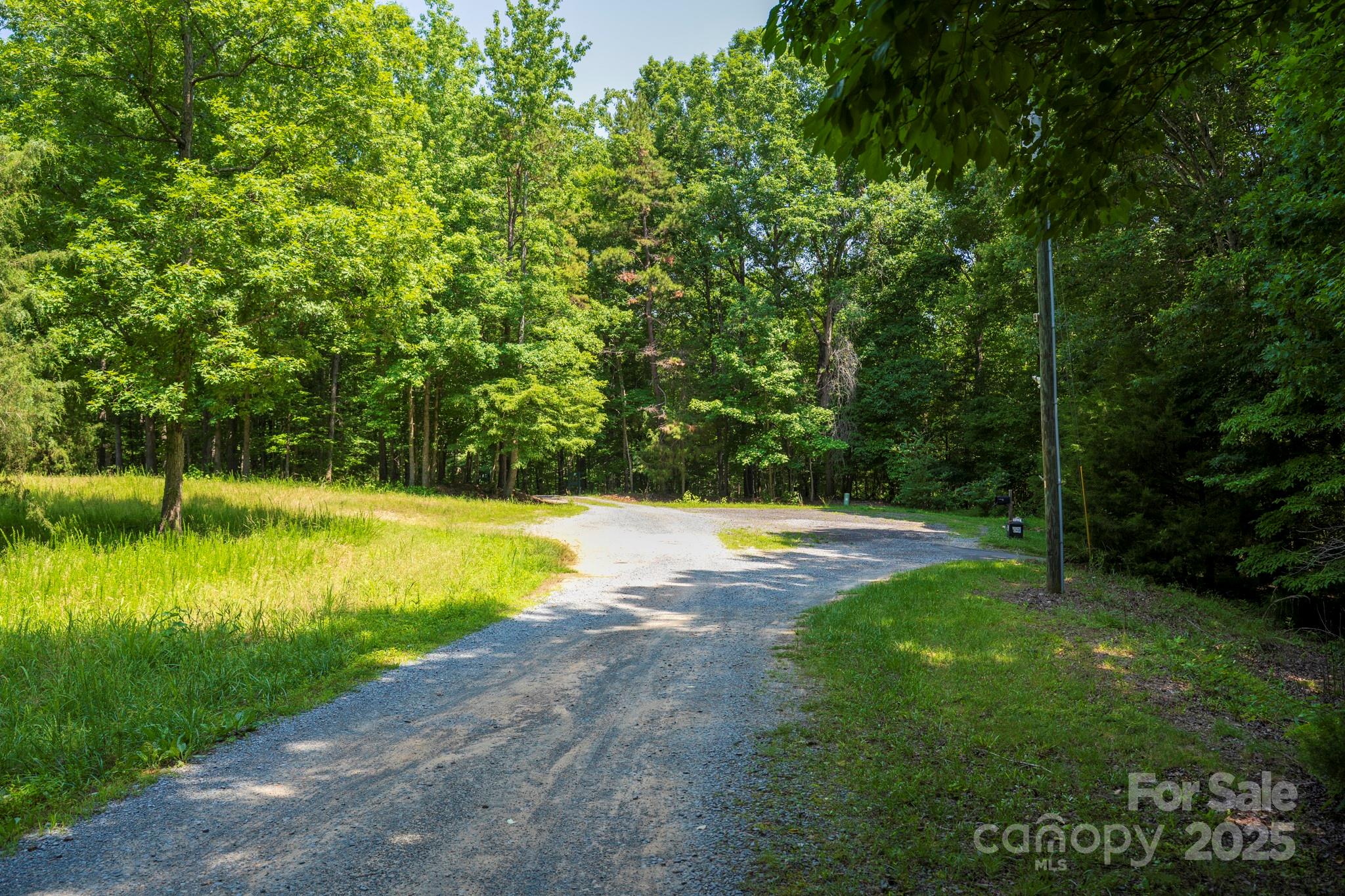 Lot 33 Valley Farm Road, Unit 33 Waxhaw, NC 28173 - Photo 30 of 35 a view of a swimming pool with a yard