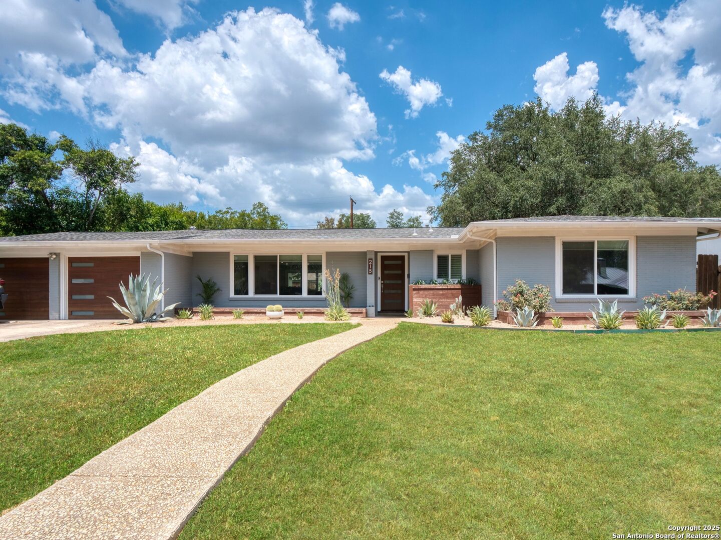 a front view of house with yard fire pit and outdoor seating