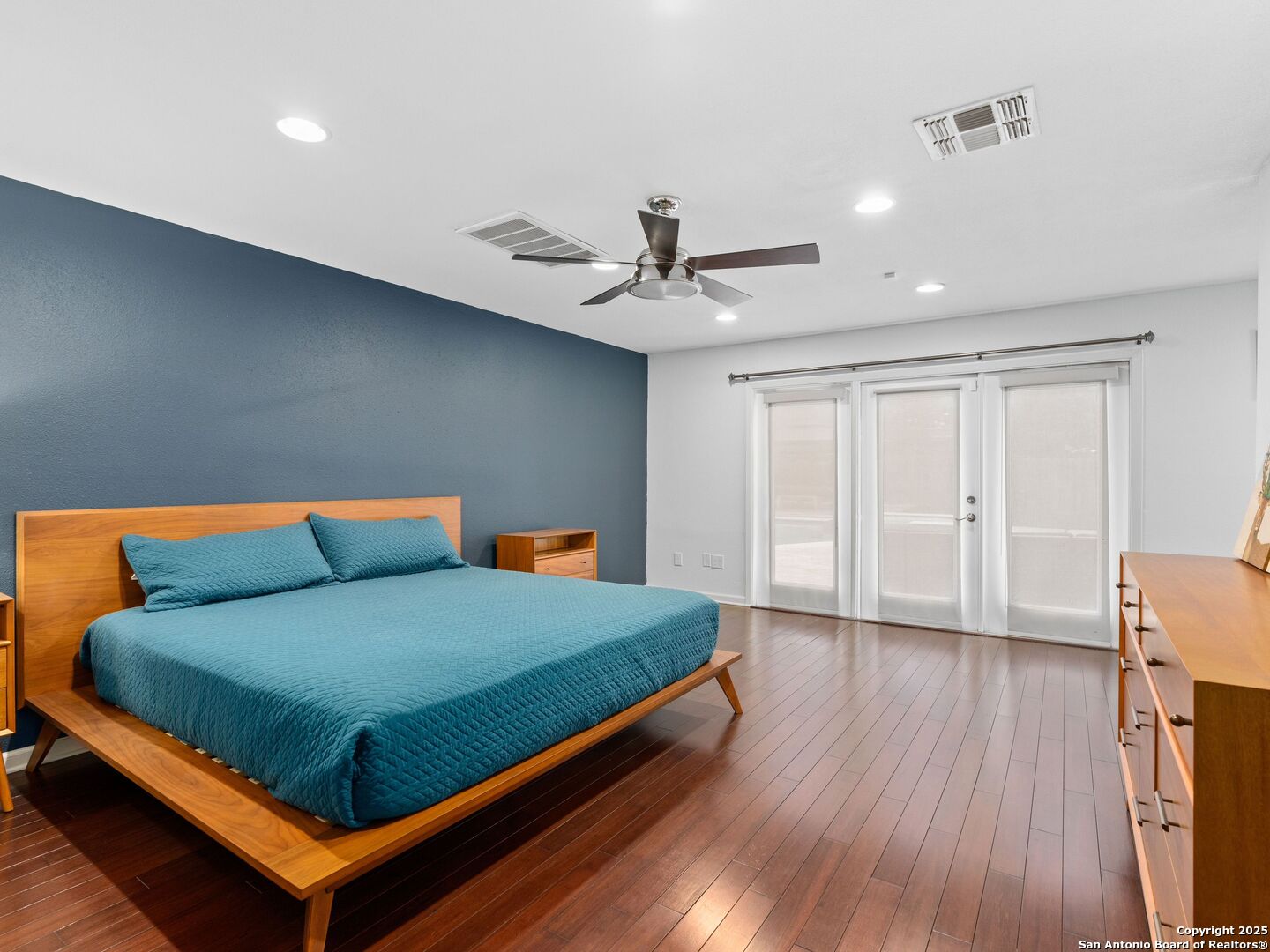 215 Tophill Road San Antonio, TX 78209 - Photo 14 of 29 a bedroom with a bed and a ceiling fan