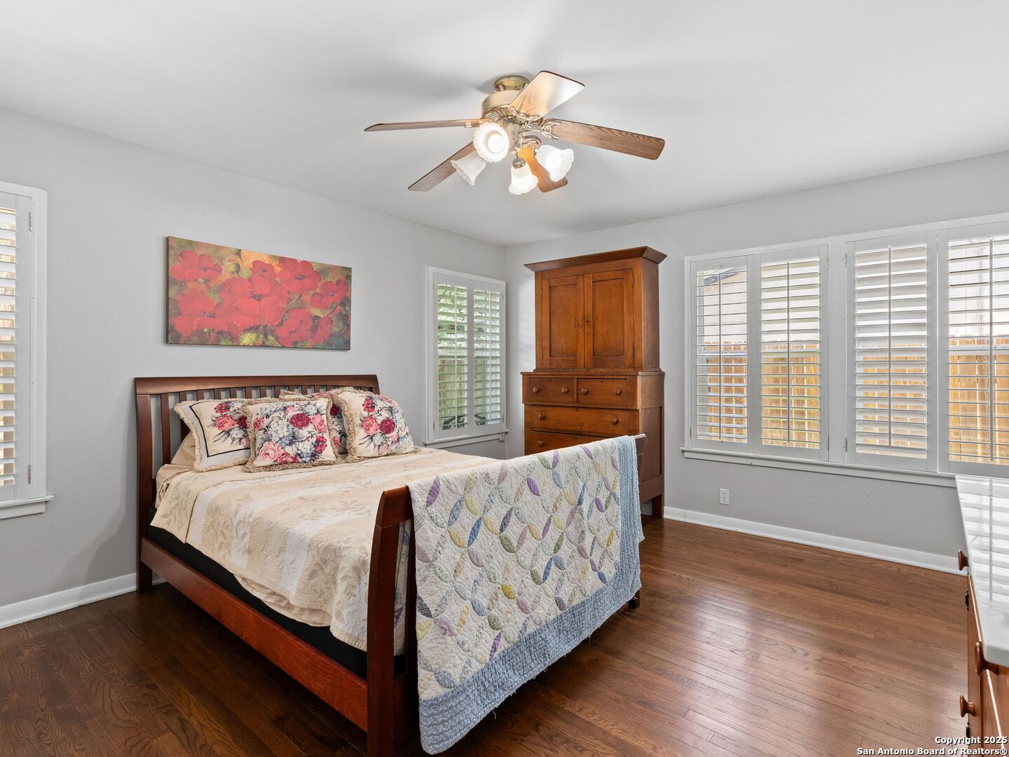 215 Tophill Road San Antonio, TX 78209 - Photo 18 of 29 a bed sitting in a bedroom next to a window