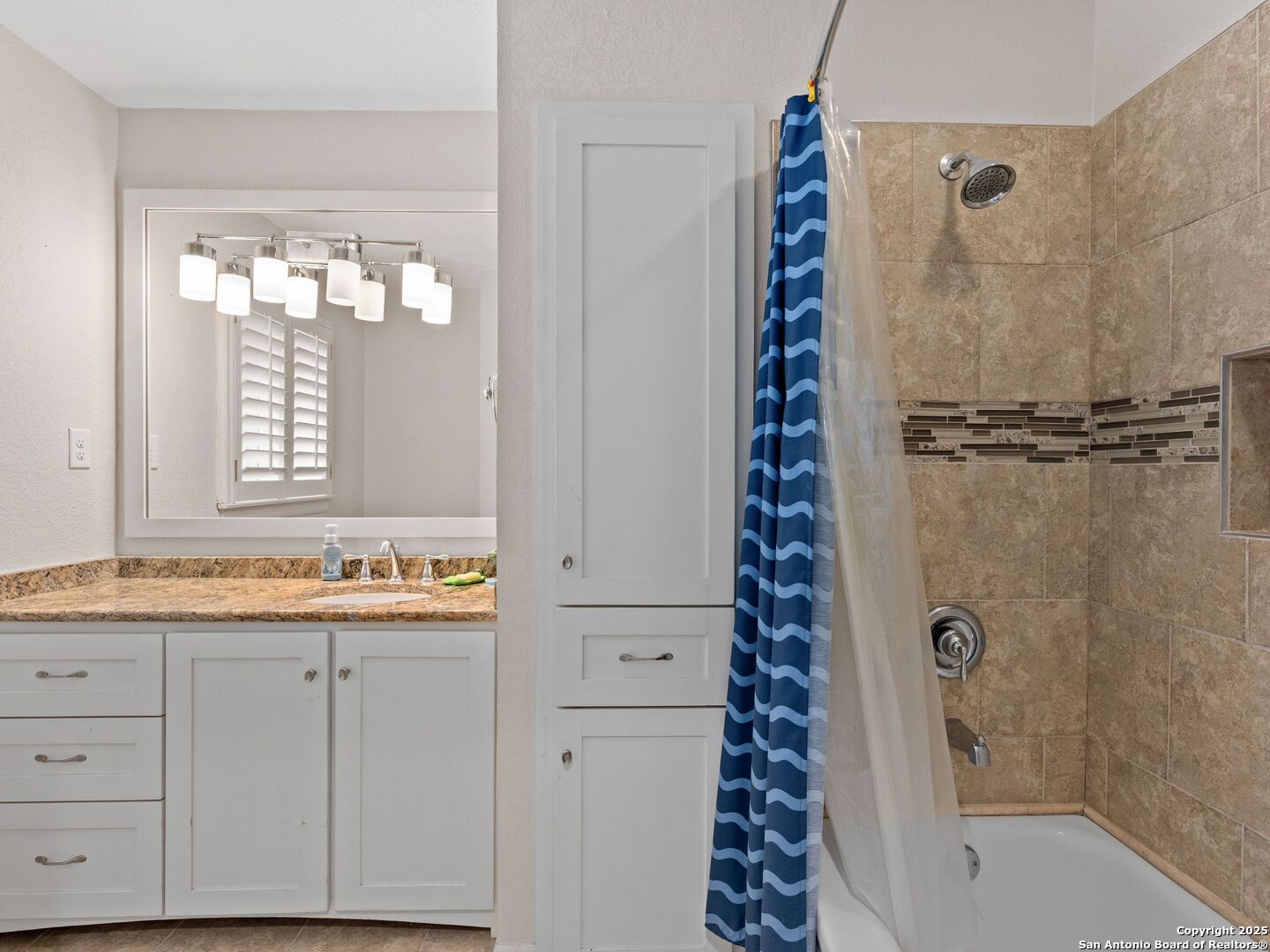 215 Tophill Road San Antonio, TX 78209 - Photo 22 of 29 a bathroom with a bathtub a sink and a shower