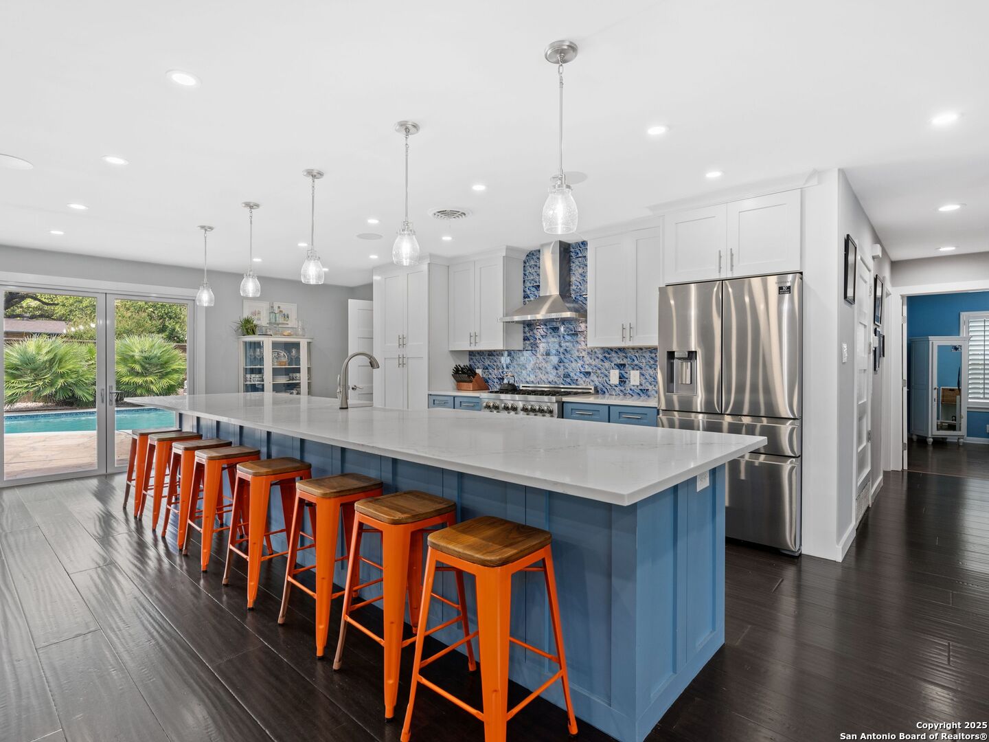 215 Tophill Road San Antonio, TX 78209 - Photo 5 of 29 a kitchen with stainless steel appliances granite countertop a table chairs and a view of living room