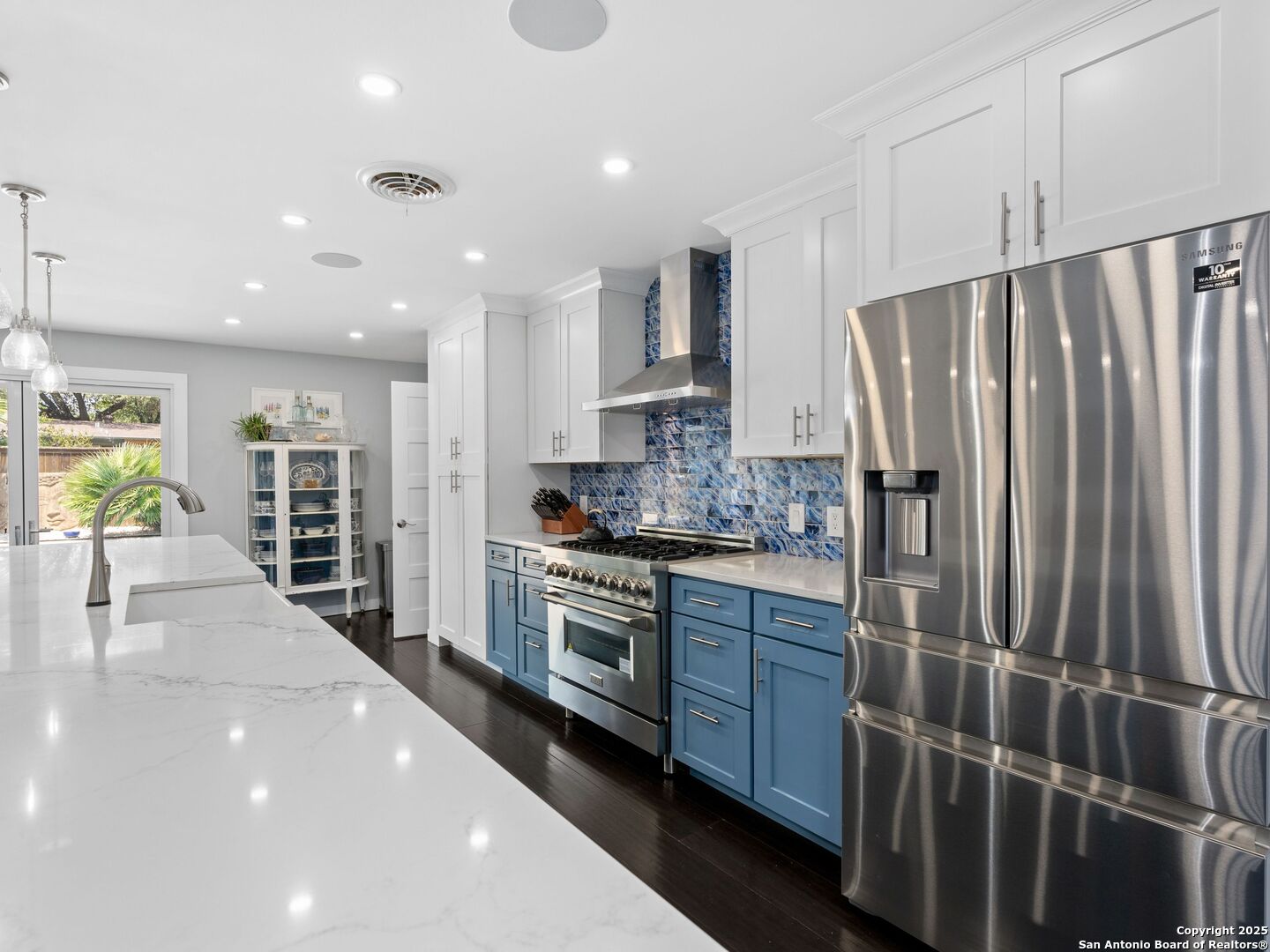 215 Tophill Road San Antonio, TX 78209 - Photo 6 of 29 a kitchen with stainless steel appliances a refrigerator and a stove top oven