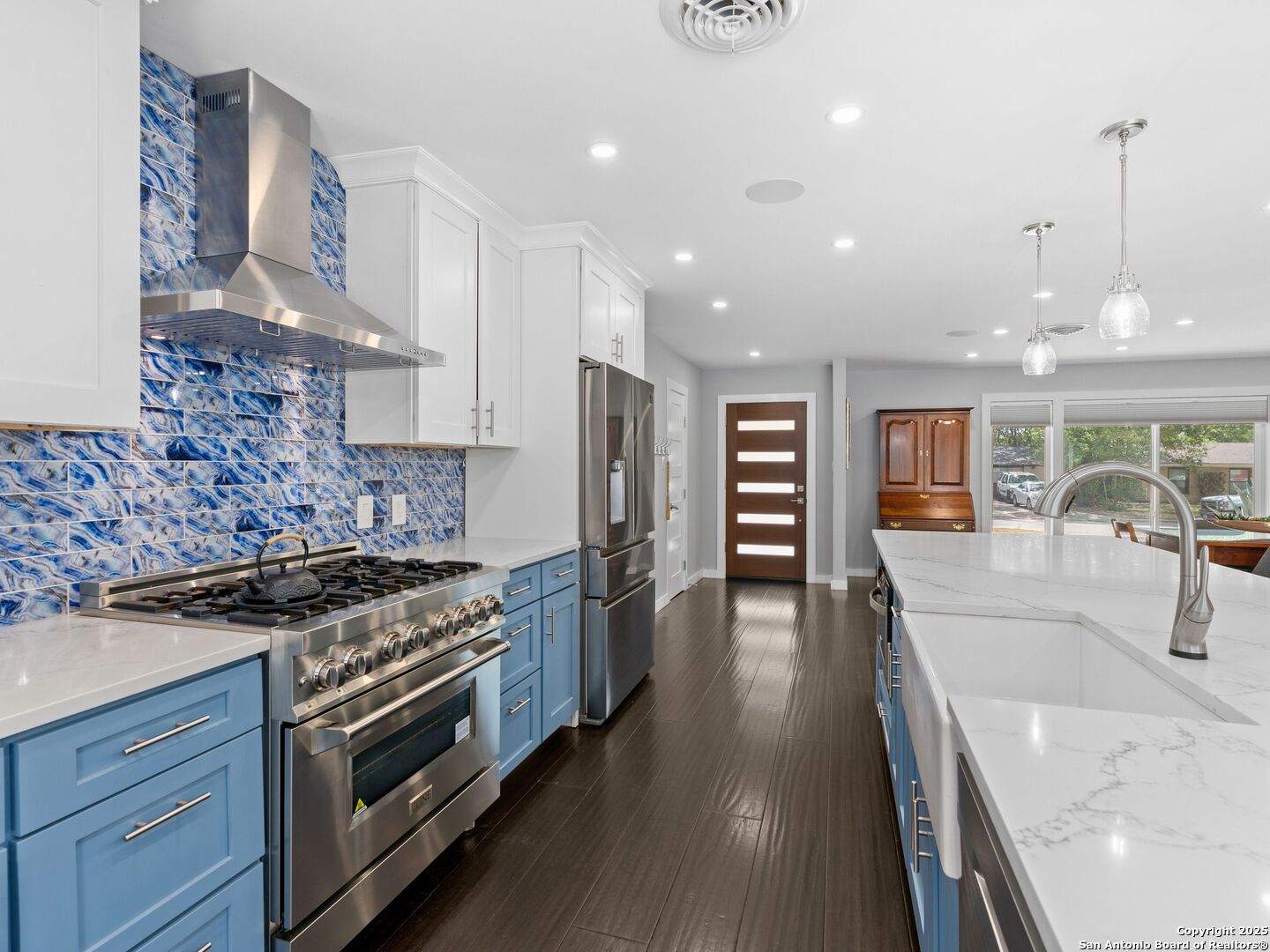 215 Tophill Road San Antonio, TX 78209 - Photo 8 of 29 a kitchen with stainless steel appliances granite countertop a stove and a sink