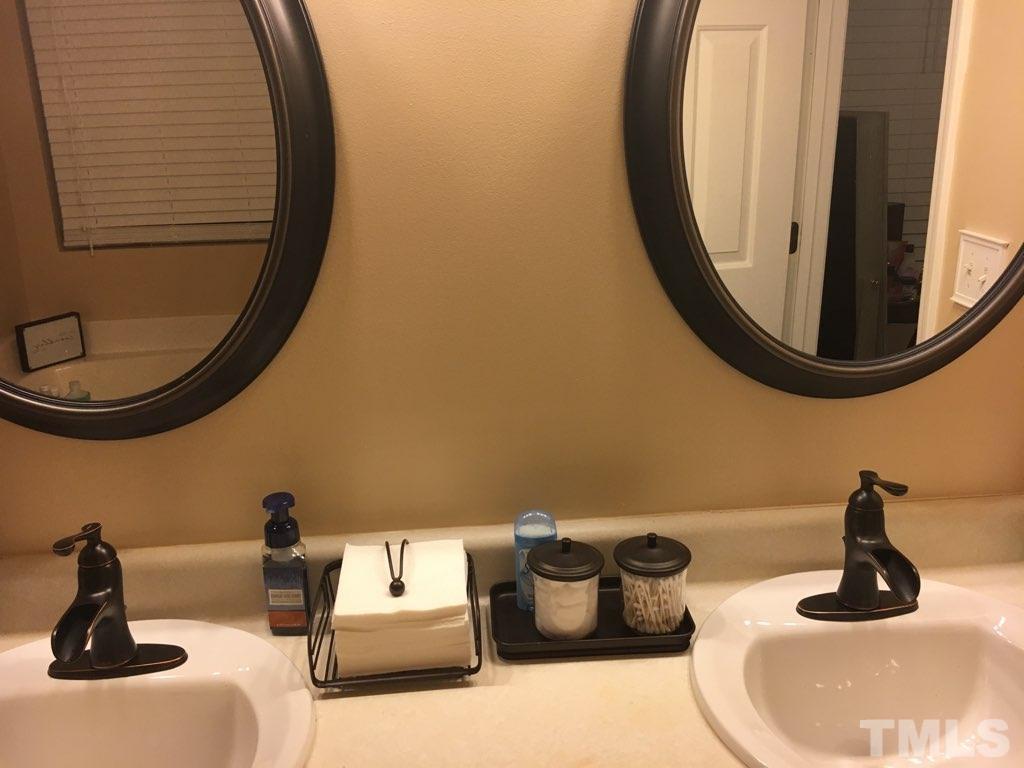 3316 Marshlane Way Raleigh, NC 27610 - Photo 6 of 7 a bathroom with a sink mirror and toilet