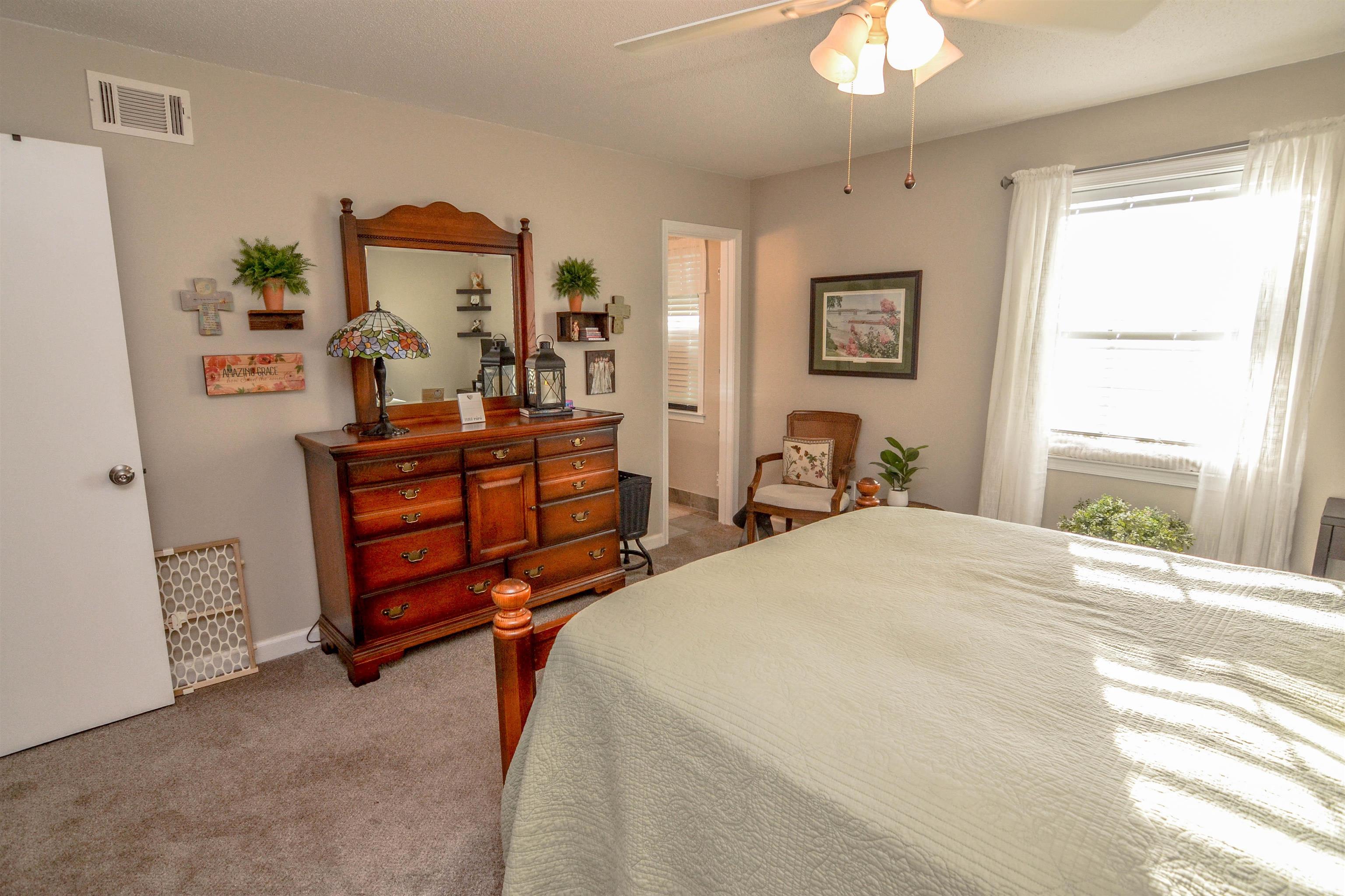 5676 Quince Road, Unit 11 Memphis, TN 38119 - Photo 15 of 22 a bed room with a bed and a chandelier