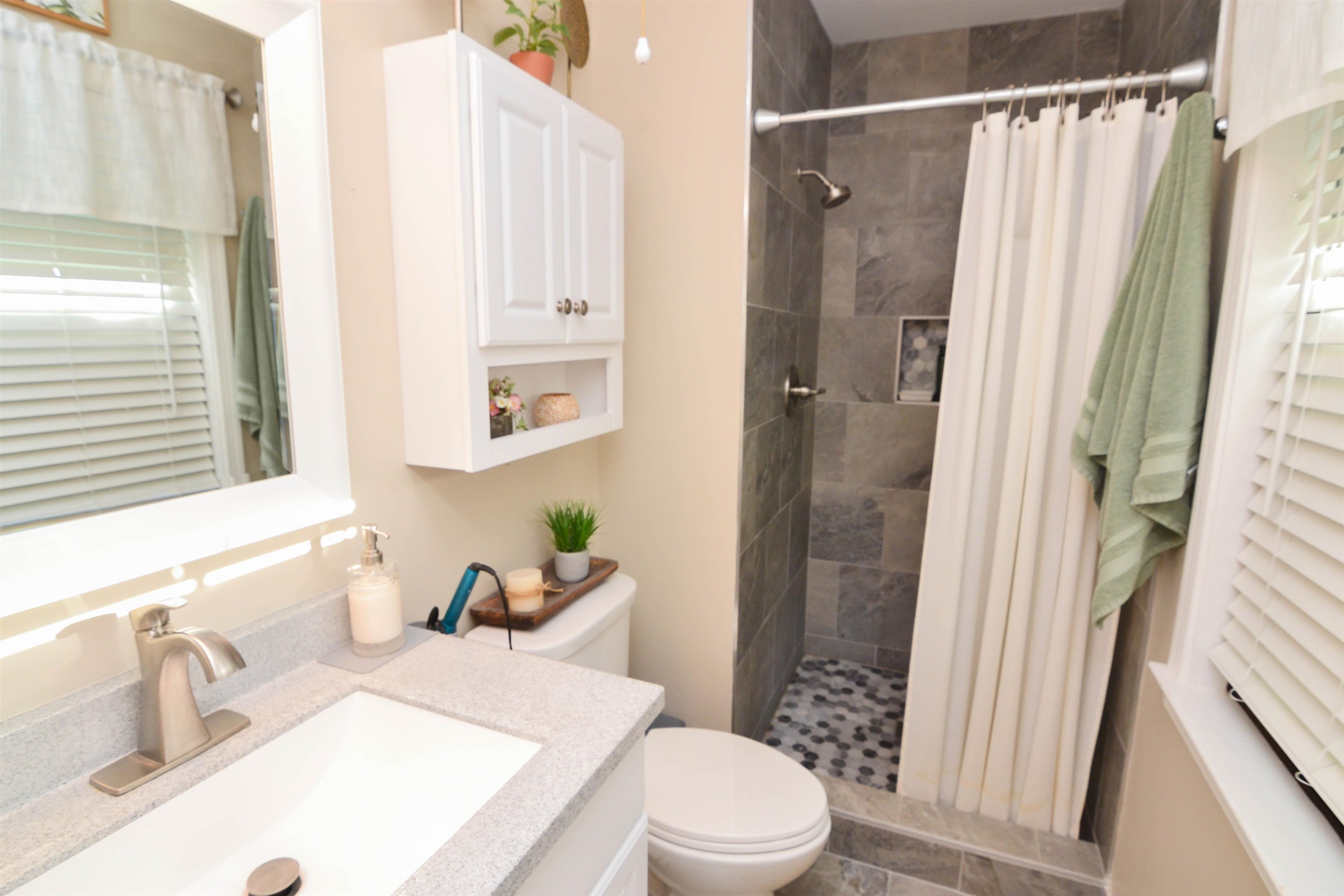 5676 Quince Road, Unit 11 Memphis, TN 38119 - Photo 16 of 22 a bathroom with a sink toilet and shower