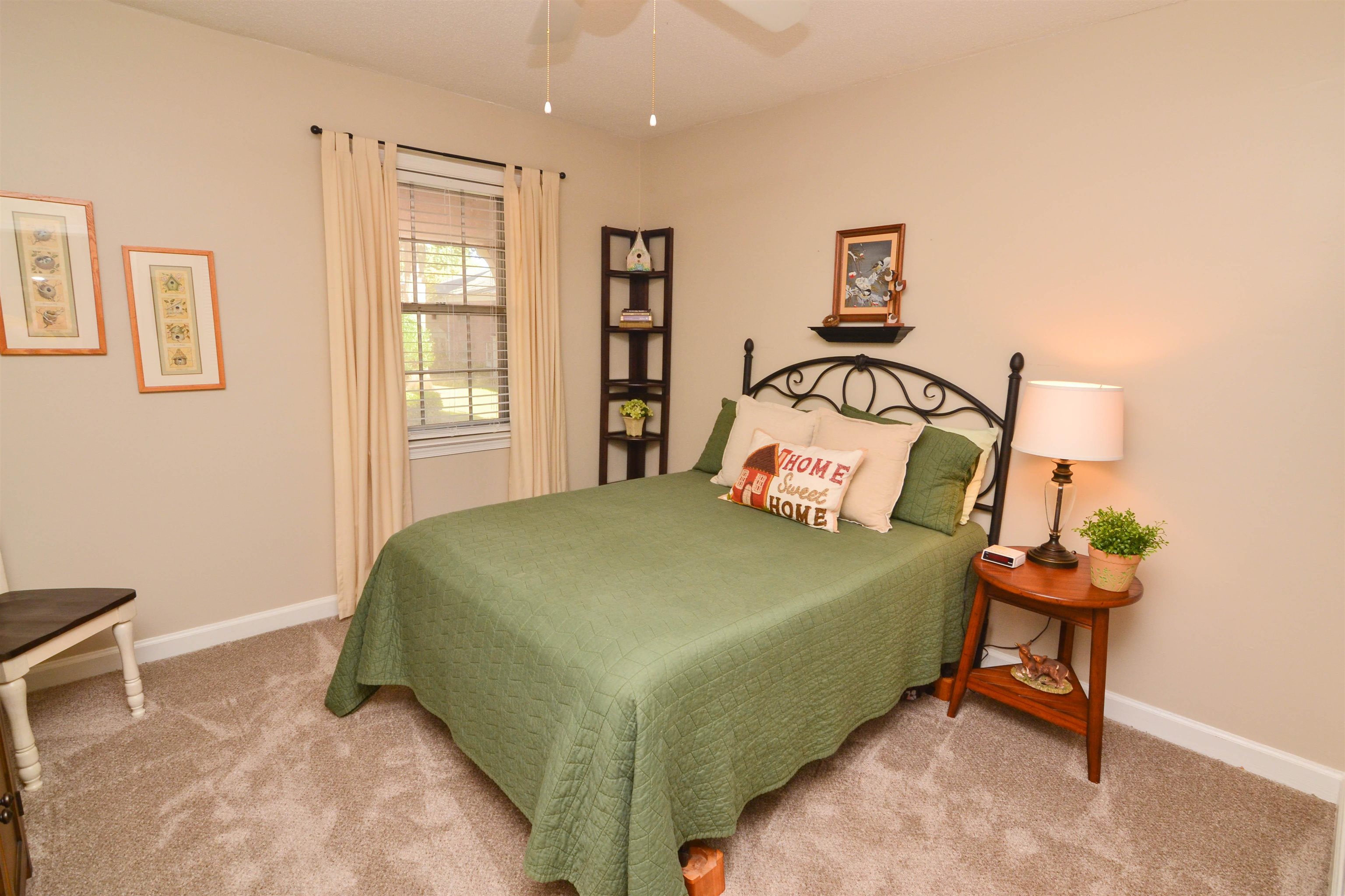5676 Quince Road, Unit 11 Memphis, TN 38119 - Photo 17 of 22 a bedroom with a bed and a window