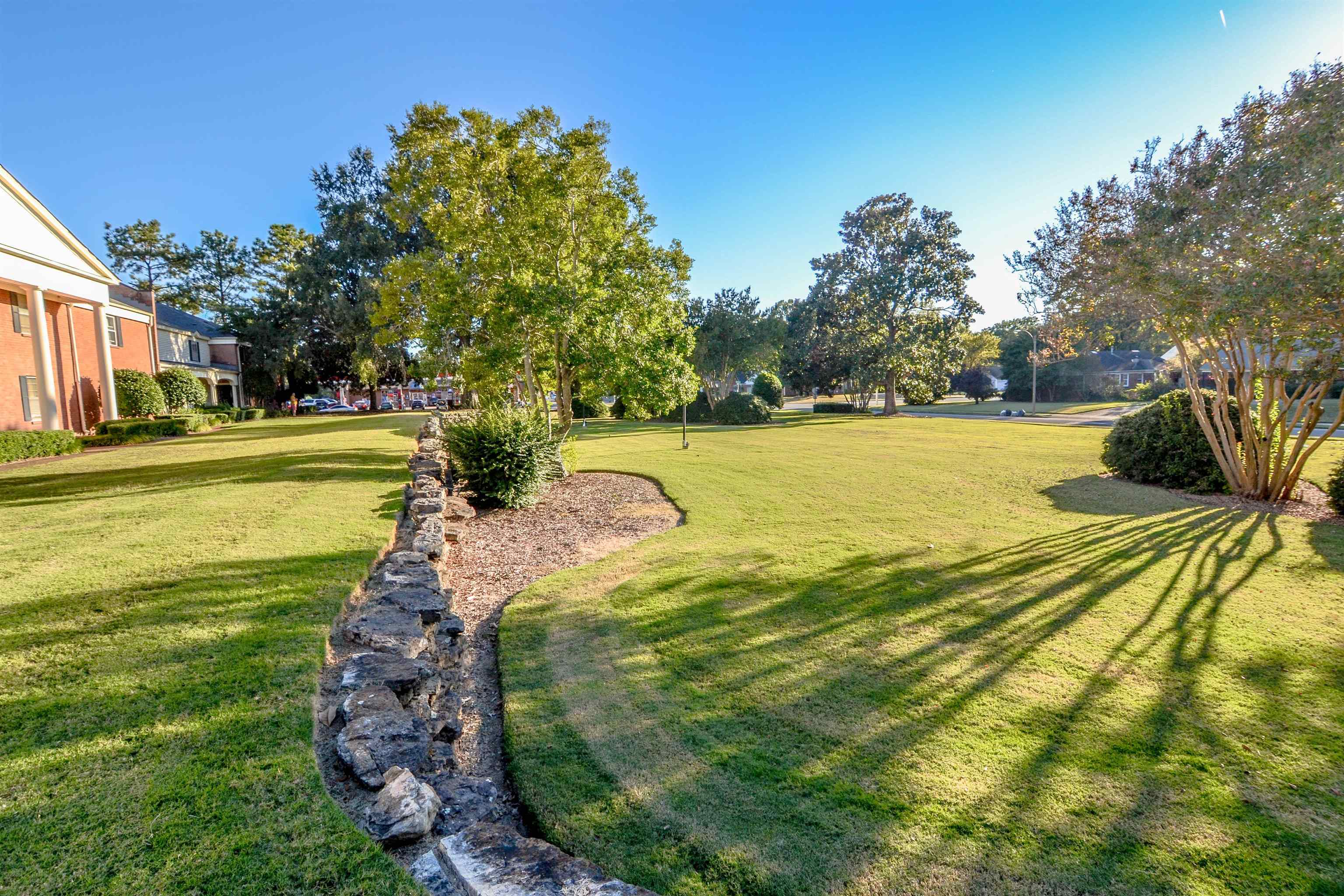 5676 Quince Road, Unit 11 Memphis, TN 38119 - Photo 3 of 22 a view of a lake with a big yard