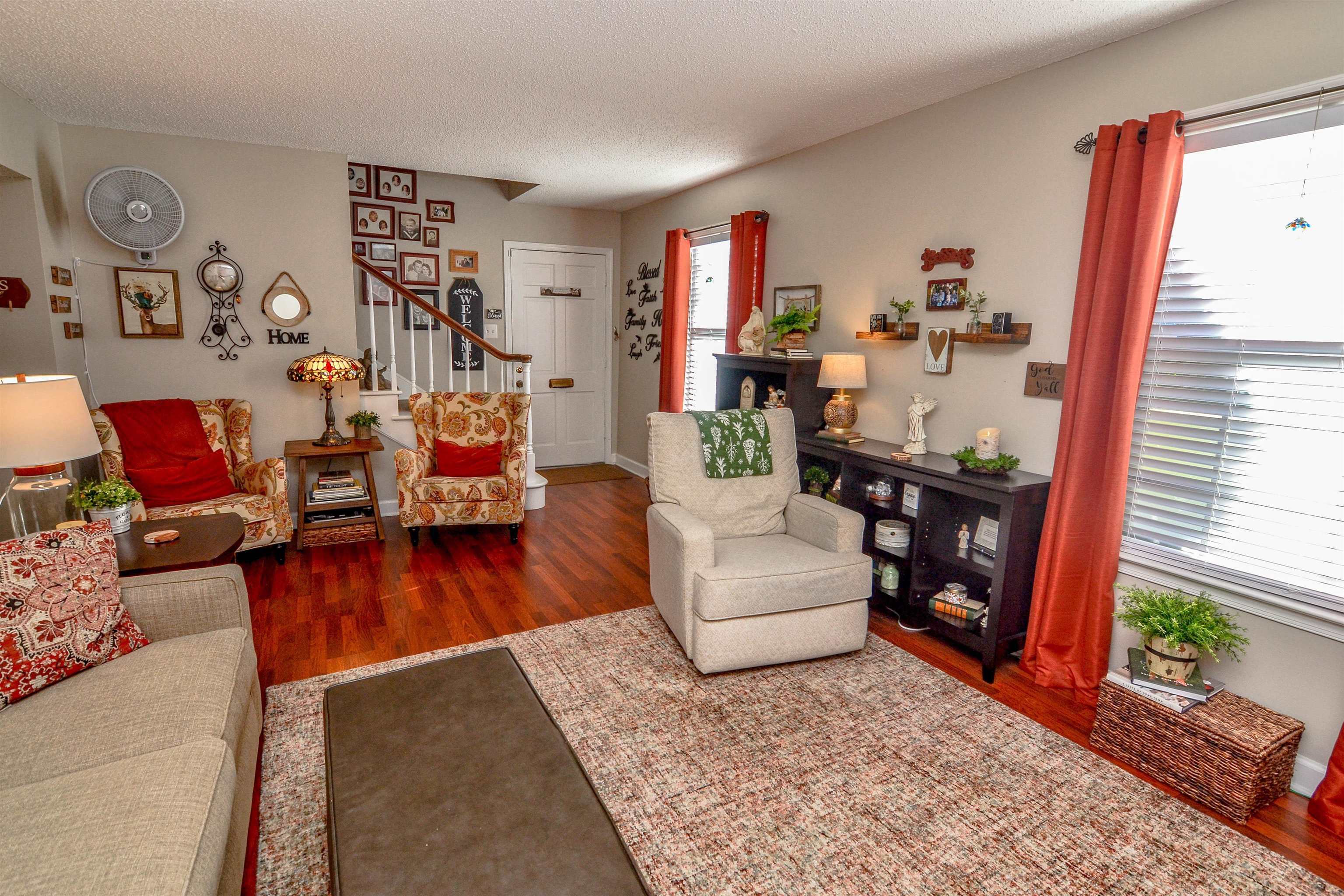 5676 Quince Road, Unit 11 Memphis, TN 38119 - Photo 5 of 22 a living room with furniture and a wooden floor
