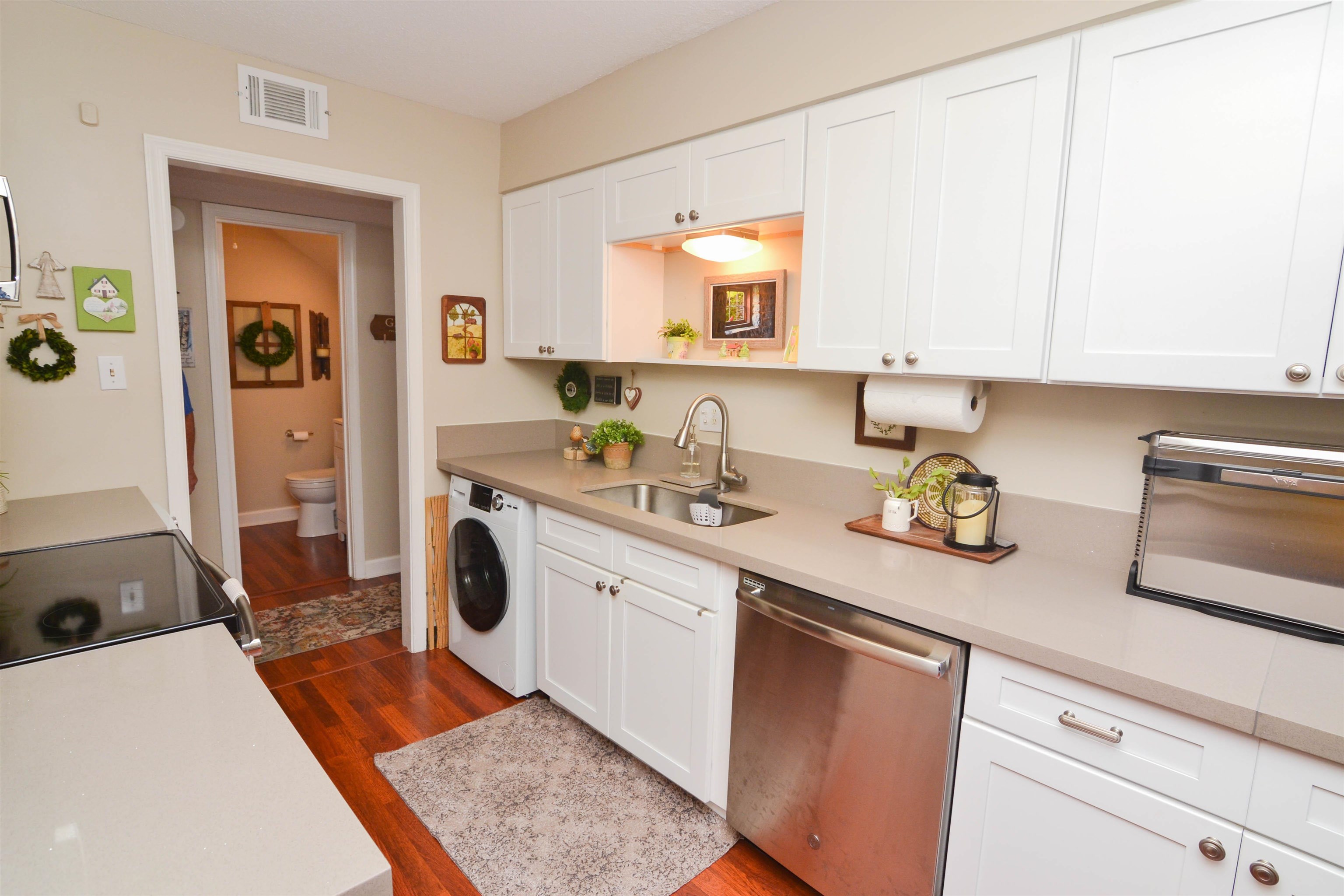 5676 Quince Road, Unit 11 Memphis, TN 38119 - Photo 10 of 22 a kitchen with stainless steel appliances granite countertop a sink stove and cabinets