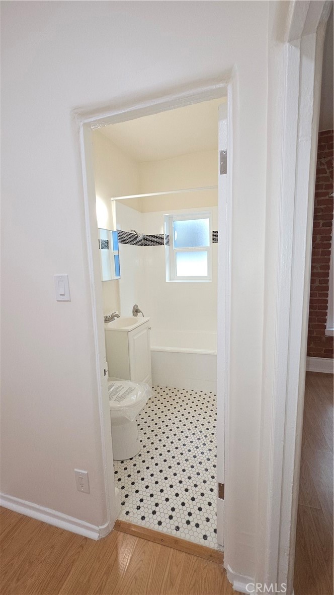 33408 Sunset Los Angeles, CA 90026 - Photo 11 of 11 a bathroom with a sink and a toilet
