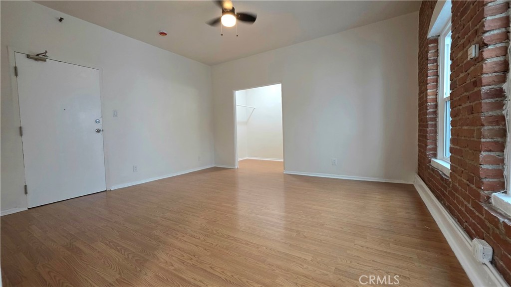33408 Sunset Los Angeles, CA 90026 - Photo 6 of 11 wooden floor in an empty room with a window