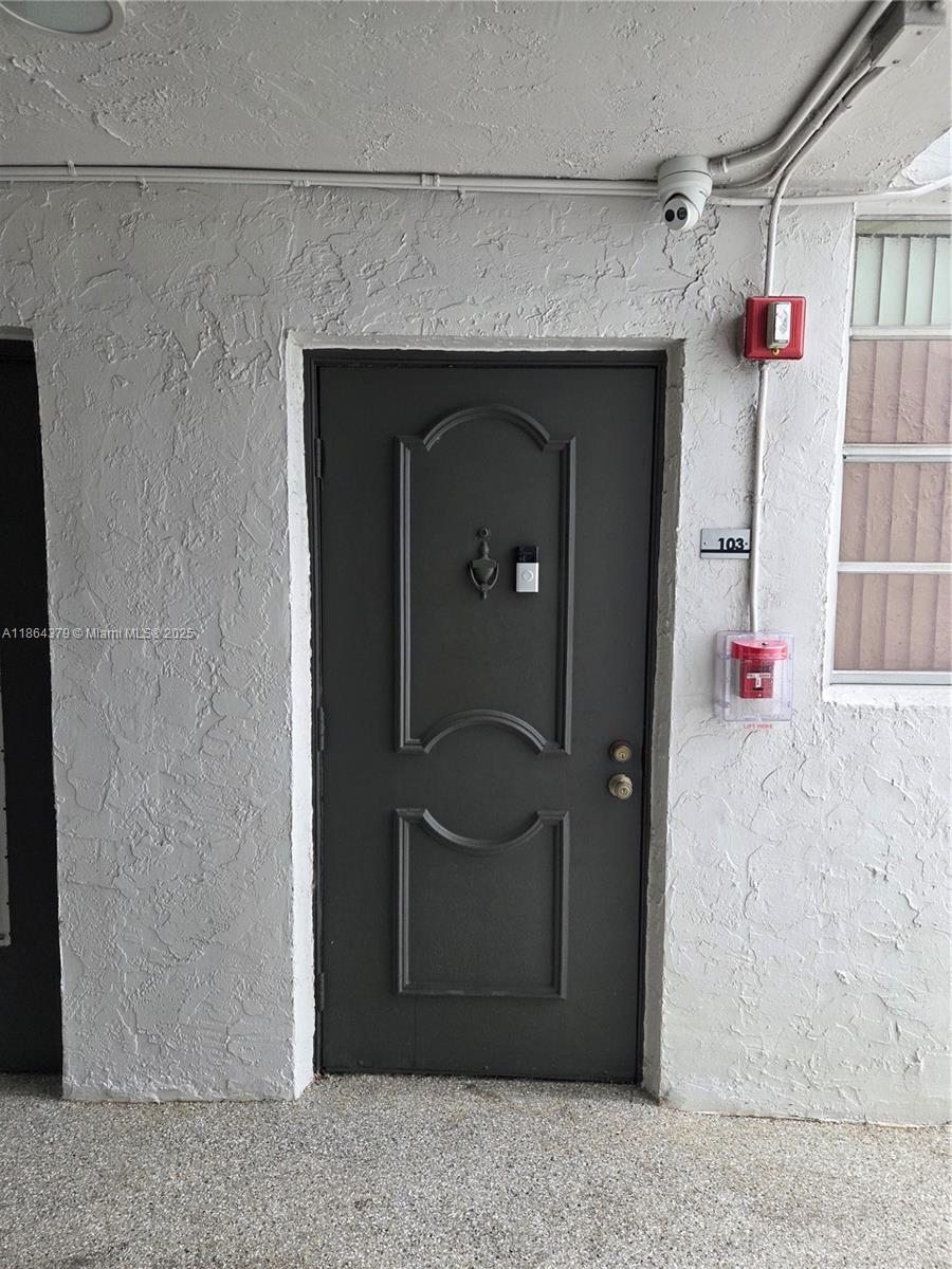 14165 Southwest 87th Street, Unit D103 Miami, FL 33183 - Photo 16 of 41 a front view of a house