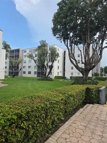 a view of front door and small yard