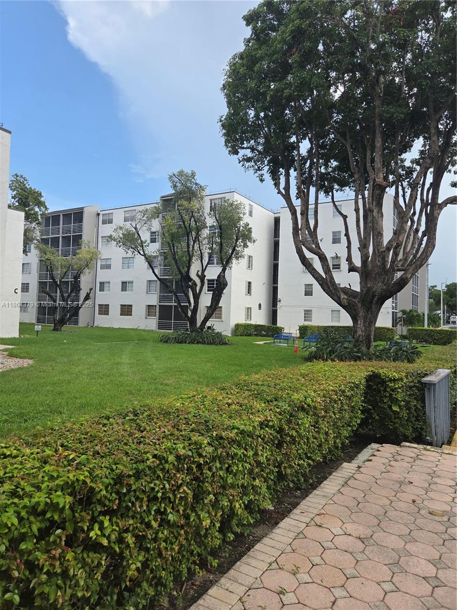 14165 Southwest 87th Street, Unit D103 Miami, FL 33183 - Photo 22 of 41 a view of a house with backyard