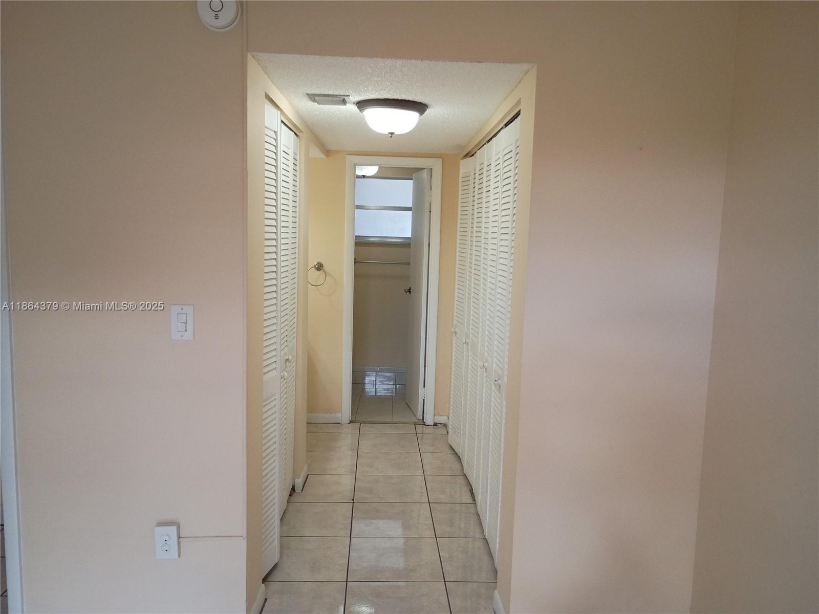 14165 Southwest 87th Street, Unit D103 Miami, FL 33183 - Photo 32 of 41 a bathroom with a sink and a mirror
