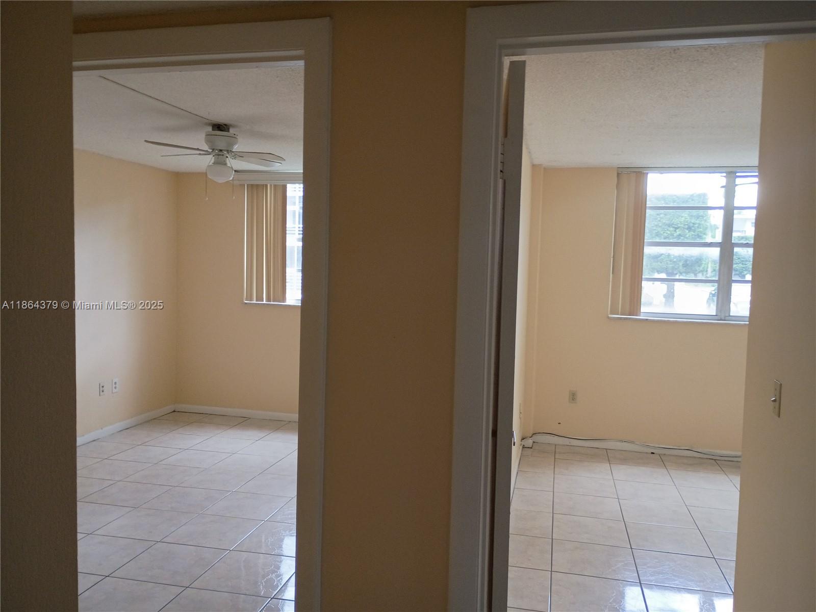 14165 Southwest 87th Street, Unit D103 Miami, FL 33183 - Photo 34 of 41 an empty room that has a window