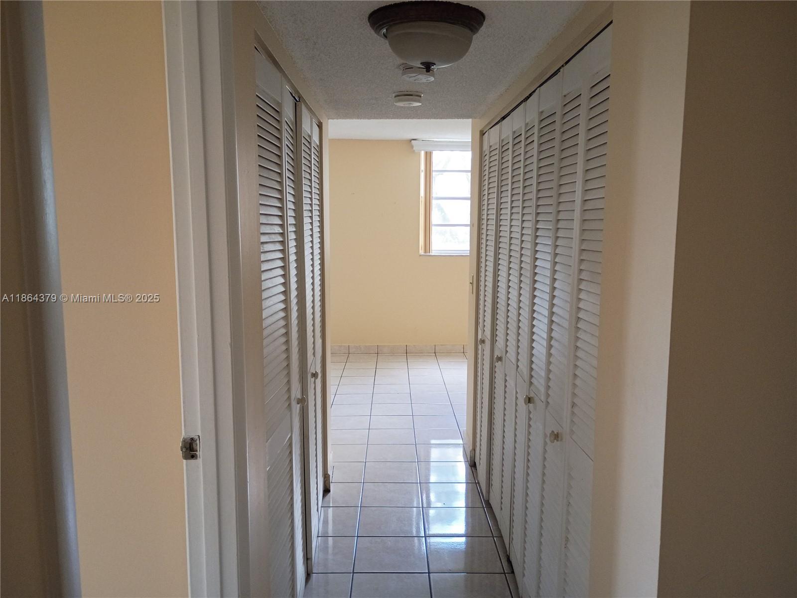 14165 Southwest 87th Street, Unit D103 Miami, FL 33183 - Photo 38 of 41 a view of a hallway