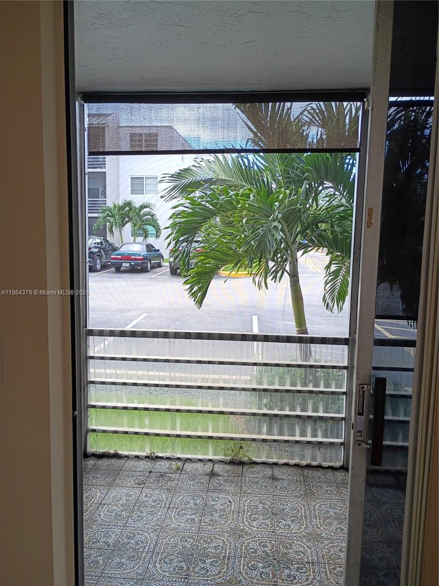 14165 Southwest 87th Street, Unit D103 Miami, FL 33183 - Photo 40 of 41 a view of a porch