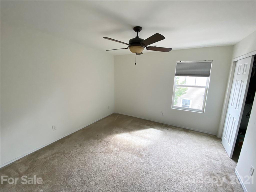750 Elders Story Road Fort Mill, SC 29708 - Photo 16 of 24 an empty room with a window and a fan