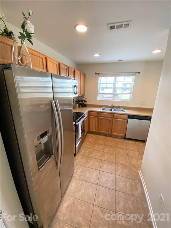 750 Elders Story Road Fort Mill, SC 29708 - Photo 10 of 24 a kitchen with granite countertop a refrigerator and a sink