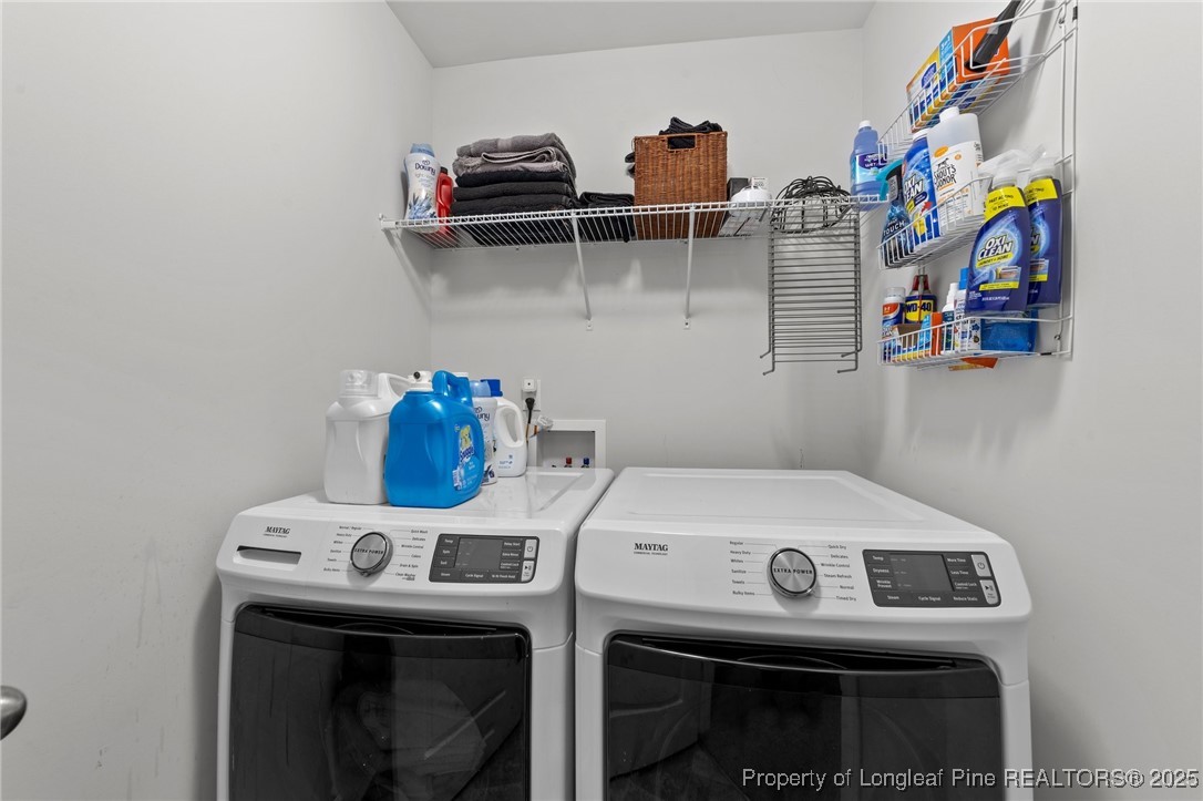 264 Mill Ridge Court Godwin, NC 28344 - Photo 23 of 43 a utility room with dryer and washer