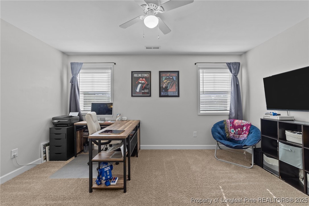 264 Mill Ridge Court Godwin, NC 28344 - Photo 24 of 43 a living room with furniture and flat screen tv