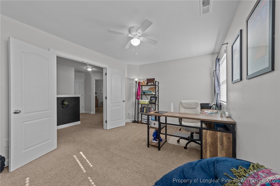264 Mill Ridge Court Godwin, NC 28344 - Photo 25 of 43 a view of a livingroom with furniture and a workspace
