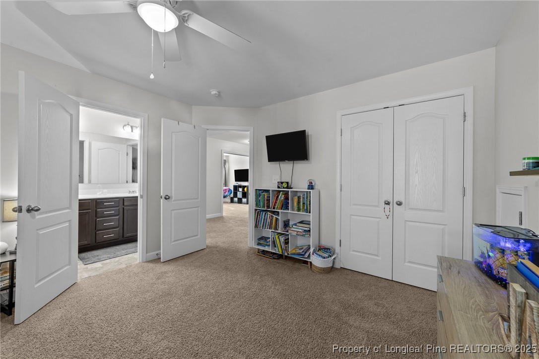 264 Mill Ridge Court Godwin, NC 28344 - Photo 30 of 43 a view of a livingroom with furniture and a ceiling fan