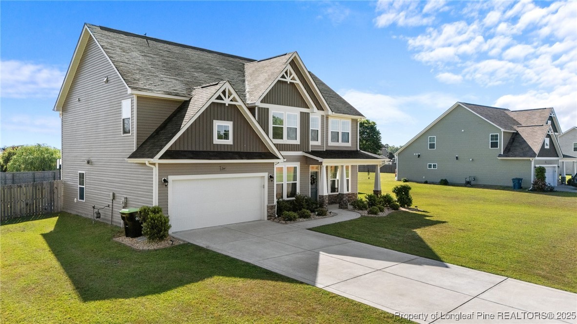 264 Mill Ridge Court Godwin, NC 28344 - Photo 42 of 43 a front view of a house with a yard
