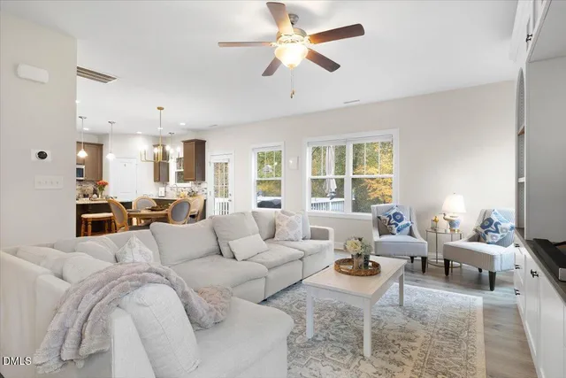 a living room with furniture or couches and a large window