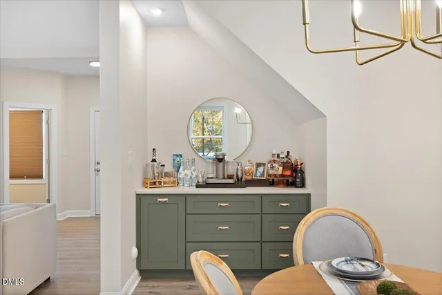 a view of a bathroom with a granite countertop sink a toilet and a mirror