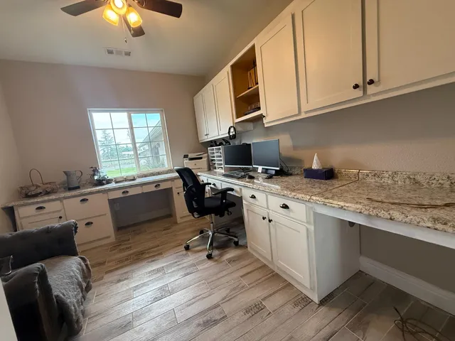 a bedroom with a bed couch and window