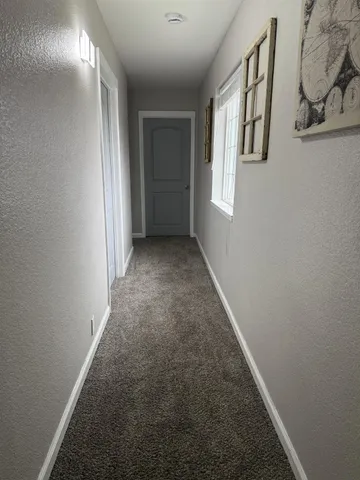 a bedroom with a bed and cabinets