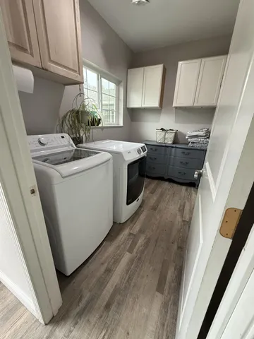 a view of bathroom with a sink and mirror