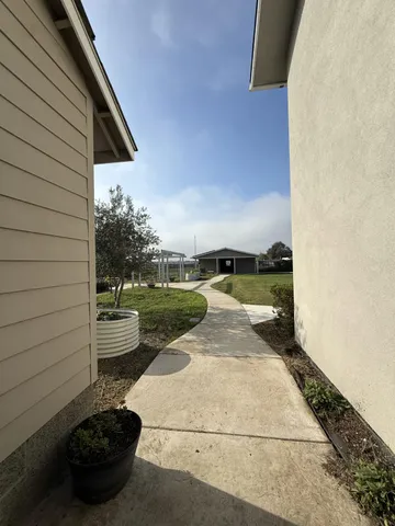 a table and chairs in front of a house