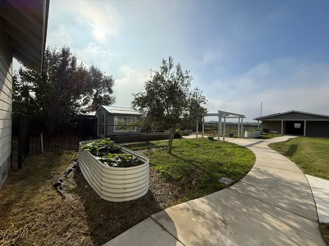 a house view with a garden space