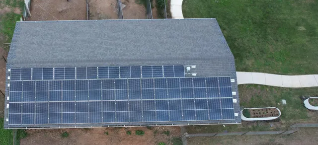 a view of a house with swimming pool and a yard