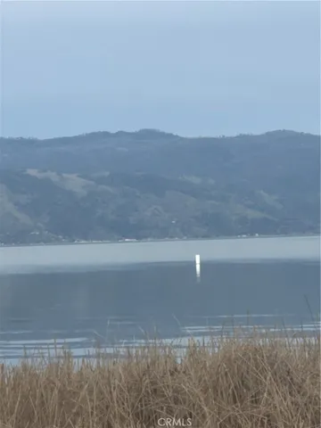 a view of ocean and a mountain