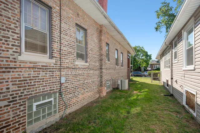 a view of backyard with barbeque grill and floor