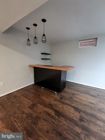 a room with furniture and wooden floor