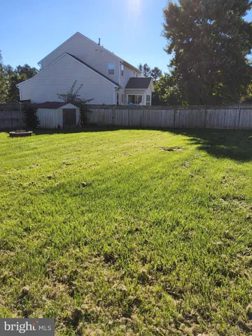 a swimming pool with wooden fence