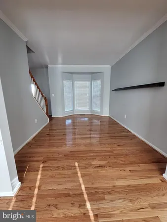 a view of an empty room with stairs