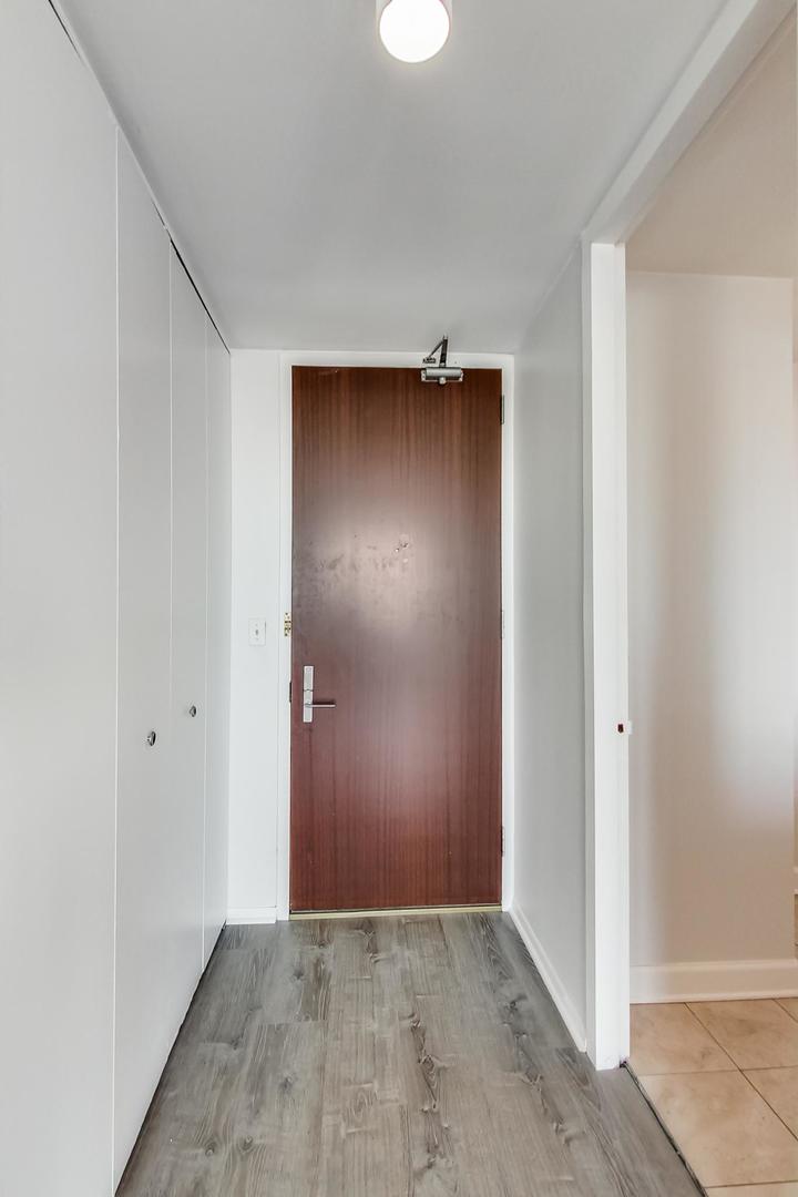 655 West Irving Park Road, Unit 5405 Chicago, IL 60613 - Photo 14 of 31 an empty room with closet area