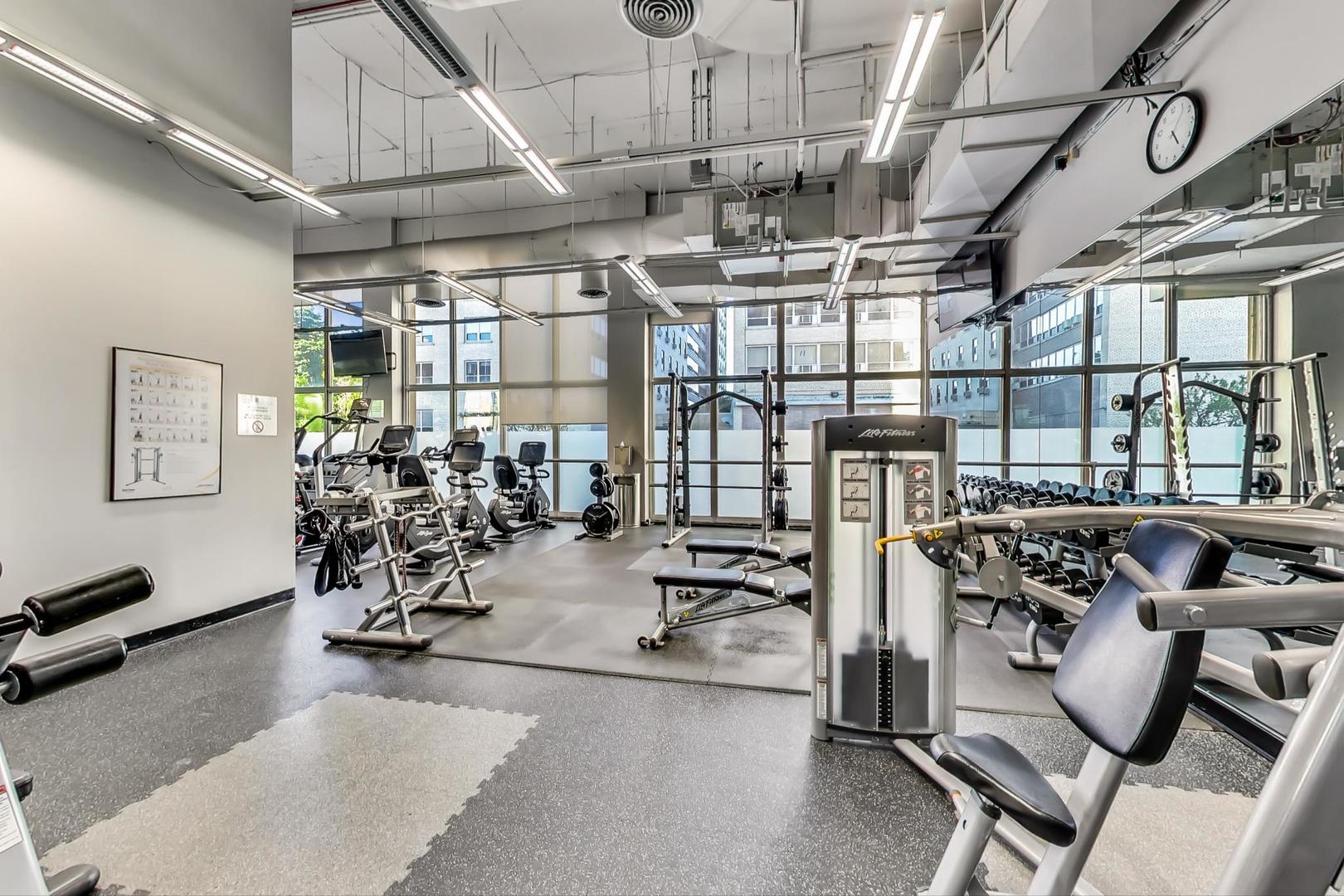 655 West Irving Park Road, Unit 5405 Chicago, IL 60613 - Photo 24 of 31 a view of a room with gym equipment