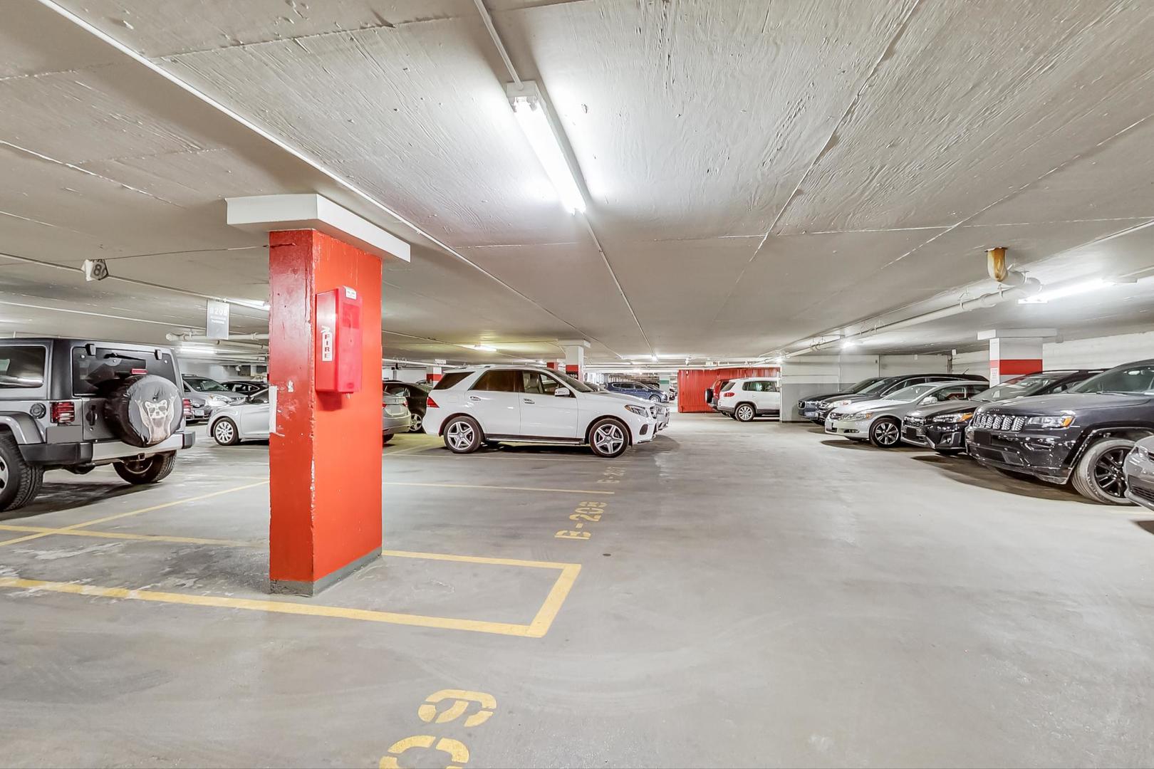 655 West Irving Park Road, Unit 5405 Chicago, IL 60613 - Photo 26 of 31 a view of cars parked in a parking