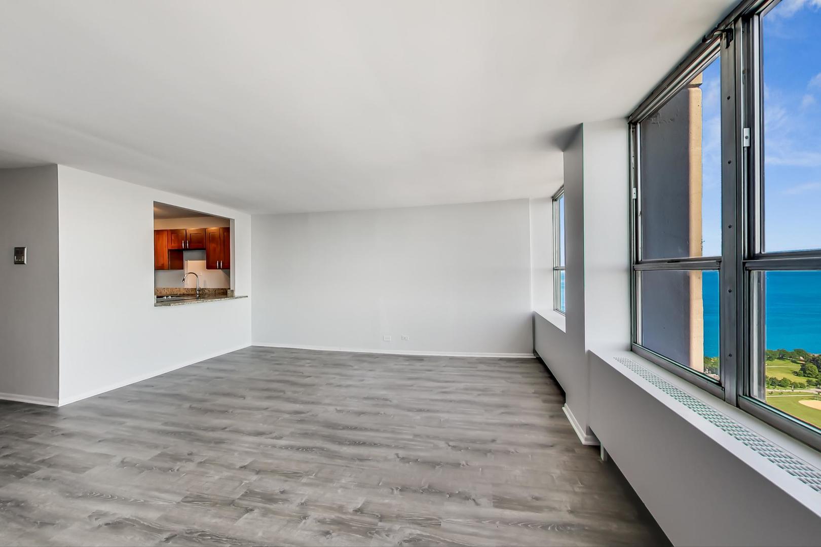 655 West Irving Park Road, Unit 5405 Chicago, IL 60613 - Photo 6 of 31 a view of an empty room with a window